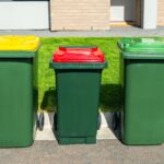 Home waste wheelie bins set on front yard