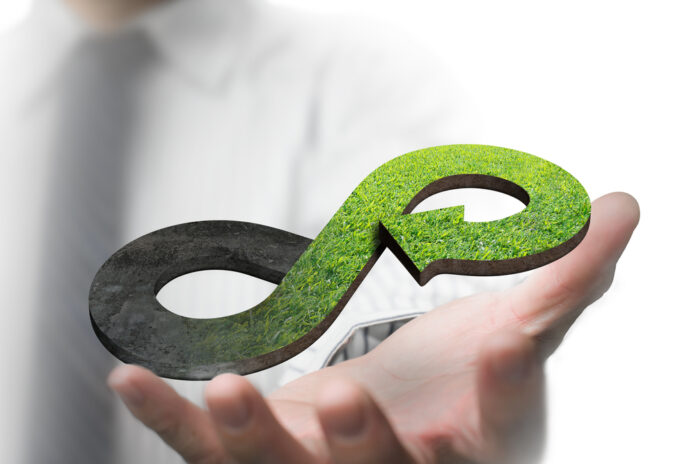 Green,Circular,Economy,Concept.,Hand,Showing,Arrow,Infinity,Symbol,With